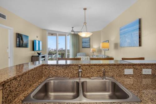 a kitchen with a sink and a counter top at Palms of Destin 2710 in Destin