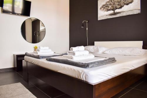 Postel nebo postele na pokoji v ubytování Apartments Motar