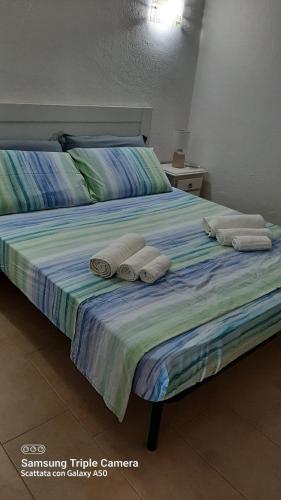 Ліжко або ліжка в номері Bilocale in centro