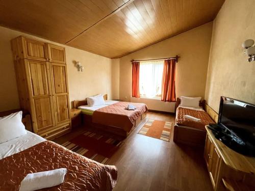 Postel nebo postele na pokoji v ubytování Vila Katerina