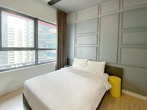 a bedroom with a large bed and a large window at Arte Plus Ampang By The Relaxstay in Kuala Lumpur