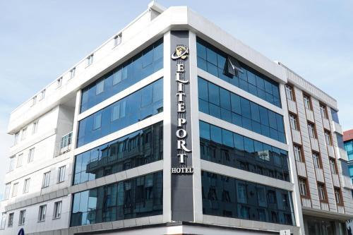 a building with a sign on the side of it at Elite Port Hotel in Arnavutköy