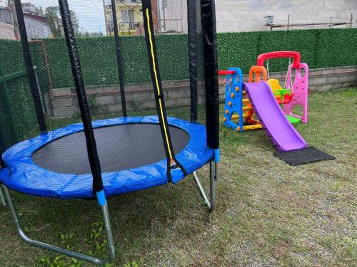 a playground with a trampoline and a slide at Imeri Hotel in Ureki