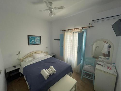 Cama o camas de una habitación en Yannis Maria Rooms