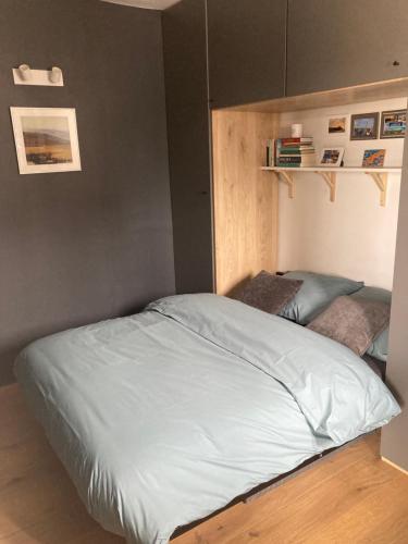 a bedroom with a large bed in a room at Seaview Penthouse Oostende in Ostend