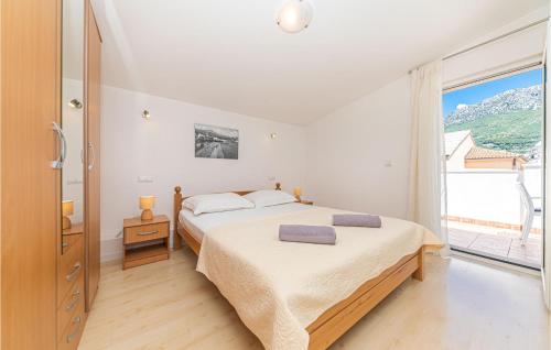 Krevet ili kreveti u jedinici u objektu 1 Bedroom Beautiful Apartment In Kastel Gomilica