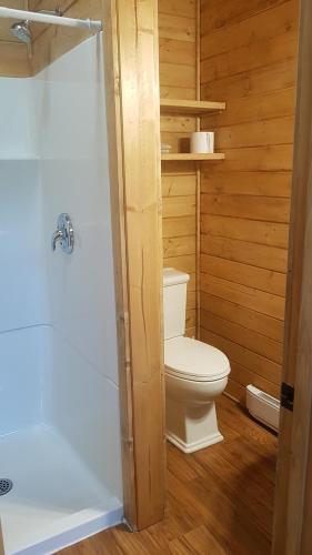 a small bathroom with a toilet and a shower at Golden Spot in Clearwater