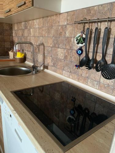 a kitchen with a sink and a counter top at Guesthouse HHL - Liman ll in Ulcinj