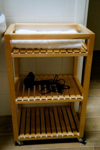 a wooden shelf with a bed on it at Agriturismo Cascina della Fontana in Lodi