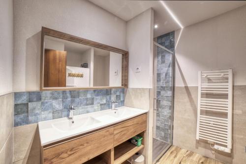 a bathroom with a sink and a shower at Carline in Morillon