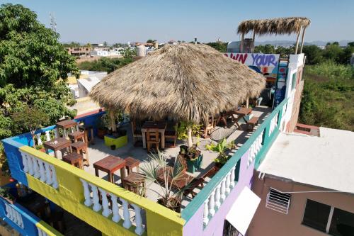 an overhead view of a restaurant with a straw roof at Sundaze Homestay in Mazatlán