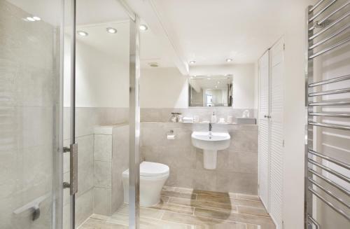 a bathroom with a toilet and a sink at The Garden Square - Unique luxury apartment in historic garden square - for up to 4 people in York