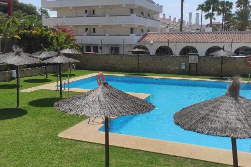 Bazén v ubytovaní Apartamento a pie de playa con jardin privado alebo v jeho blízkosti