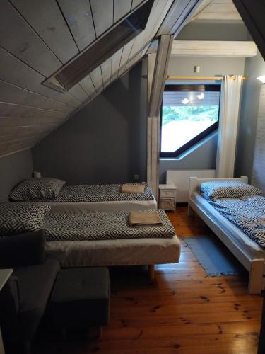 Postel nebo postele na pokoji v ubytování Siedlisko Ostropest Karbowskie 9a