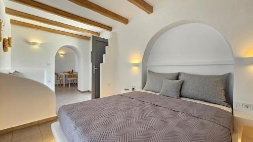 a bedroom with a large bed in a room at Polychronis Private Suite in Pollonia