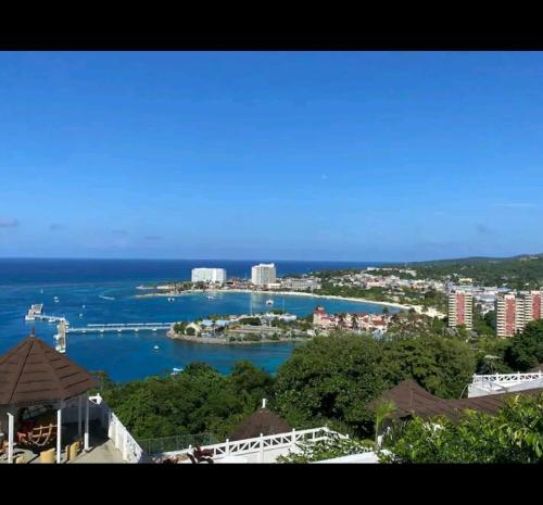 a view of a city and a body of water at Casa de Columbus in Ocho Rios