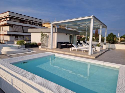 a swimming pool on the roof of a building at Acca residence in Terracina