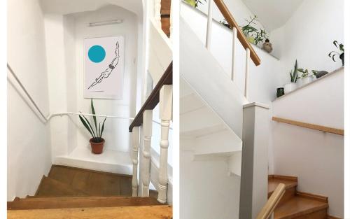 a staircase in a home with white walls and wood floors at Placa Apartments in Mošćenička Draga