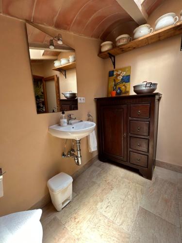 a bathroom with a sink and a toilet at Casa Padrina Burballa in Maria de la Salut