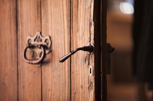 an open wooden door with a handle on it at Hotel Finca Ca N'ai - Adults Only in Sóller