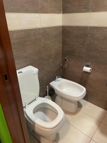 a bathroom with a toilet and a bidet at Manolo in Santa Rosa