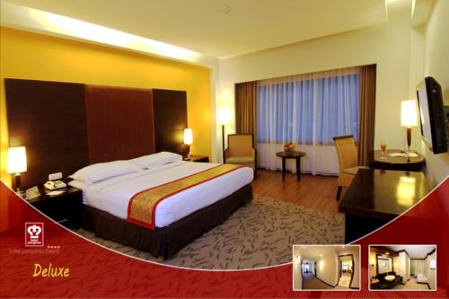 En eller flere senge i et værelse på Pangeran Beach Hotel
