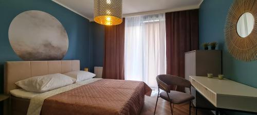 מיטה או מיטות בחדר ב-Mazovia Gold Apartament 101