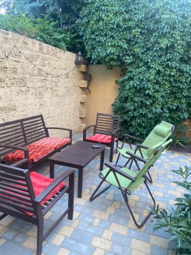 a group of chairs and tables on a patio at Дом для отдыха на Фонтане in Odesa
