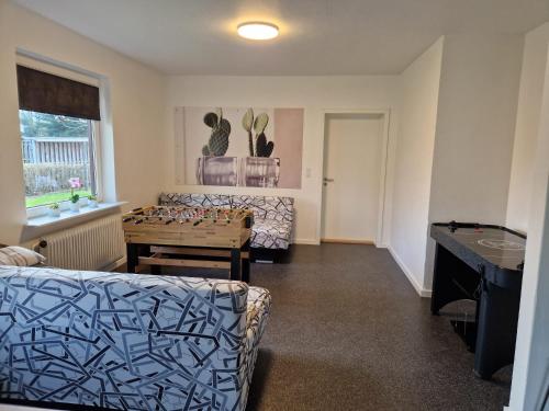 a living room with a couch and a table at Guest House Rens in Bylderup-Bov