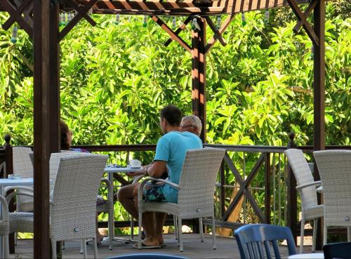 a man and a woman sitting at a table at Marina Hotel in Ayia Napa