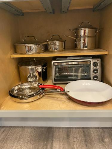 a kitchen counter with a plate and a toaster oven at Clear Lake Retreat: Private pool, lakefront in Orlando