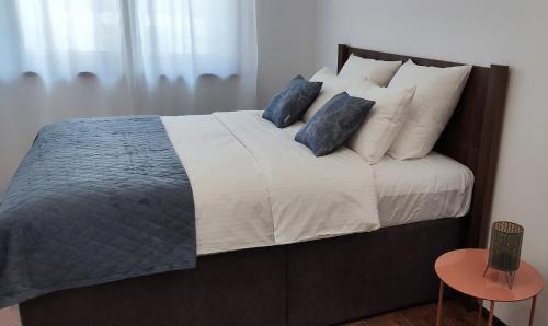 Una cama o camas en una habitación de Apartman Modiano