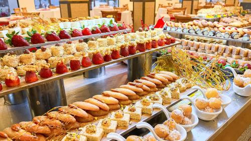a buffet line with many different types of food at Sharm Club Beach Resort in Sharm El Sheikh