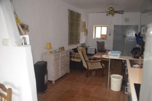 a kitchen with a desk and a table in a room at Casa Eckhoff 3A Polopos- Underbar utsikt in Polopos