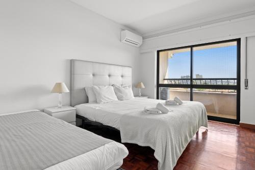 מיטה או מיטות בחדר ב-Cascais Terrace