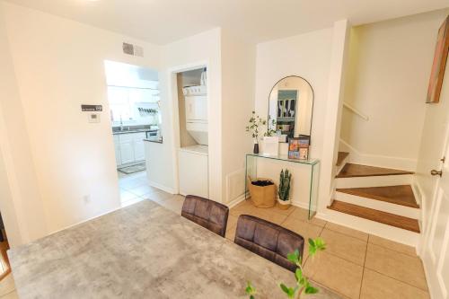 a living room with two chairs and a staircase at Centrally Located 2BR Overton Square Unit 1 Fast WiFi Free Parking Yes Pets in Memphis