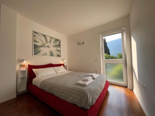 Кровать или кровати в номере La Dolce Vita Arco
