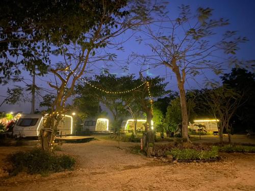 a campsite at night with tents and lights at Phukasa Valley Maesot in Ban Mae Kasa