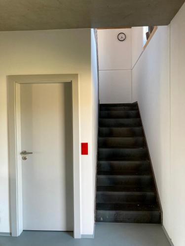 a staircase in a building with a stair case at Domek u ráje in Bystřice