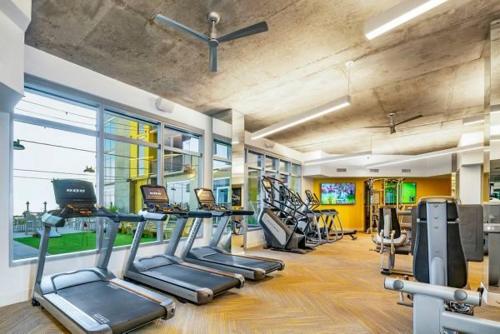 a gym with several treadmills and machines in it at Highrise the Heart of Downtown in Phoenix