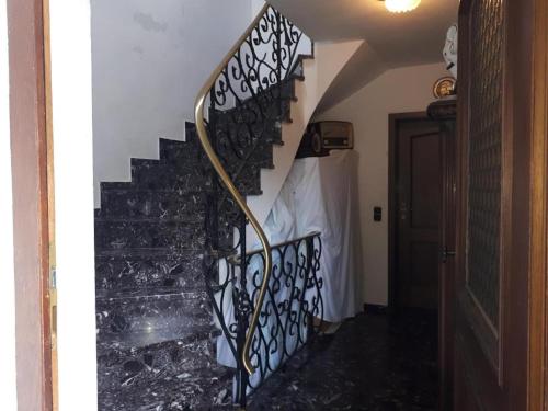 a stairway with a black and white stair railing at Karl-Stieler-Str. ONE ROOM in a 2 ROOM APPARTMENT ; LOT SPACE in Bruckmühl