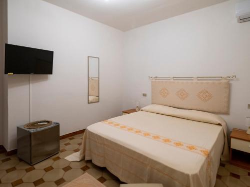 Кровать или кровати в номере B&B Da Laura San Teodoro