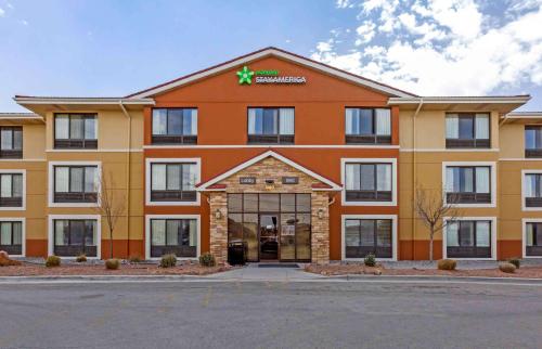 a large orange building with a pharmacy at Extended Stay America Suites - El Paso - West in El Paso
