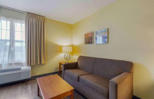 a living room with a couch and a table at Extended Stay America Suites - Chantilly - Dulles in Chantilly