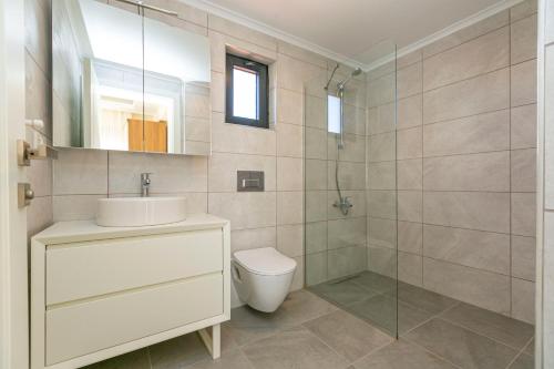 a bathroom with a toilet and a sink and a shower at Paradise Town Villa Cordelia 100 MBPS free wifi in Belek