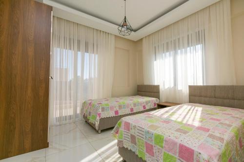 A bed or beds in a room at Paradise Town Villa Cordelia 100 MBPS free wifi