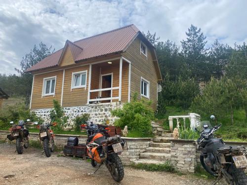 two motorcycles parked in front of a house at Bujtina Oxhaku i Docit in Peshkopi