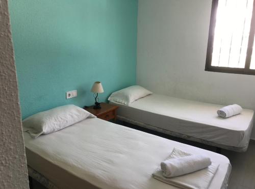 A bed or beds in a room at TARONGERS 7