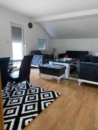 a living room with a couch and a table at Rok in Tešanj