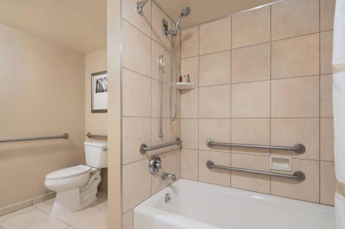 a bathroom with a shower and a toilet at Anaheim Marriott Suites in Anaheim